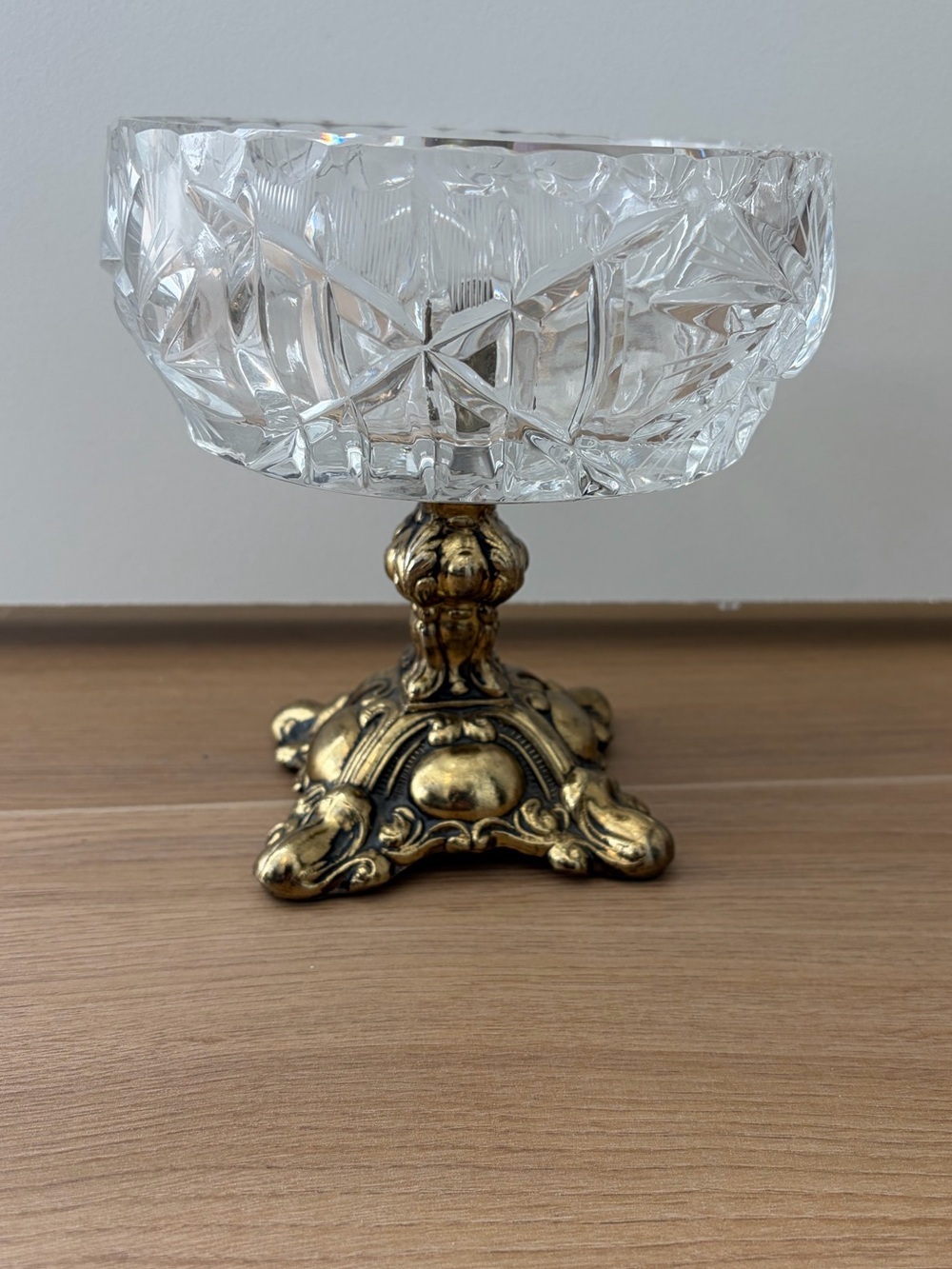 Hollywood Regency style cut crystal compote bowl on a ornate metal pedestal base